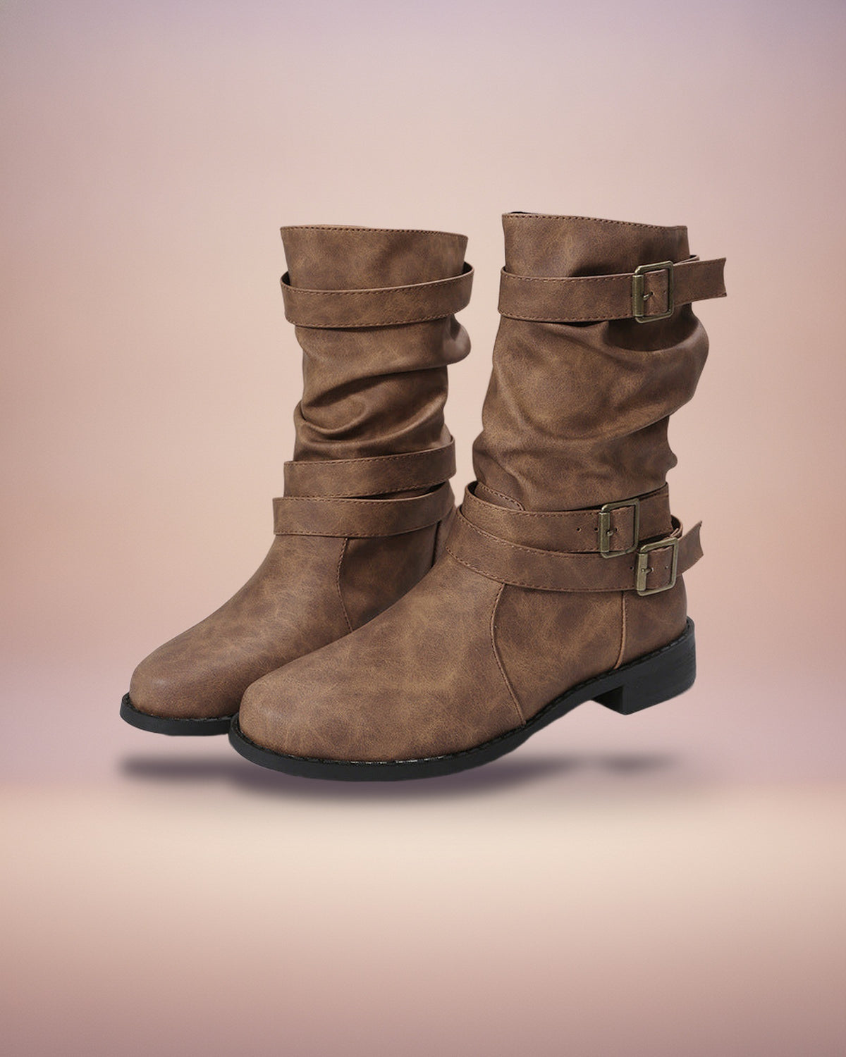 Brown buckled mid-calf boots, studio view