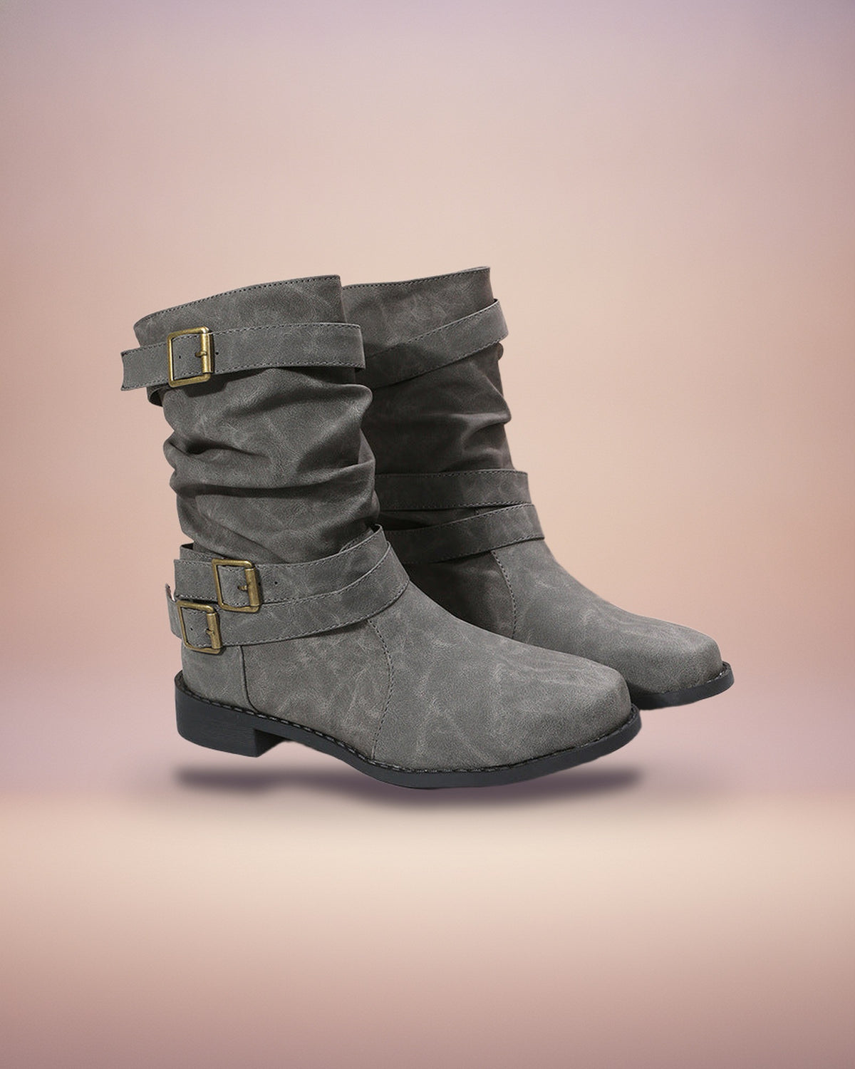 Gray buckled mid-calf boots, studio view